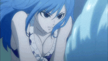 a woman with blue hair and a white top is looking at something