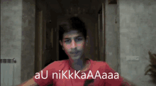 a young boy in a red shirt says " au nikkaaa "