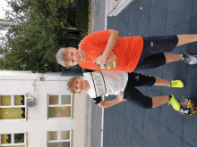 two boys are posing for a picture with one wearing a shirt that says ' puma ' on the front