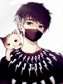 a boy wearing a black mask holds a small cat on his shoulder