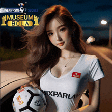 a woman is holding a soccer ball in front of a museum bola logo