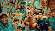 a group of young men are posing for a photo in front of a sign that says rift