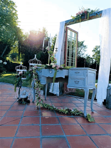 a table with a mirror and candles on it