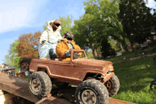 a toy jeep with the word tonka on the tire