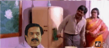 a man with a mustache is standing in front of a refrigerator in a room