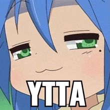 a close up of a cartoon character with blue hair and green eyes with the words ytta written on her face .