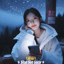 a woman wearing glasses is looking at her phone in front of a sign that says sip