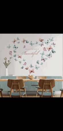 a wall with butterflies and the words be your own kind of beautiful on it