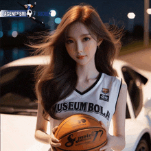 a woman in a museum bola jersey holds a basketball in front of a car