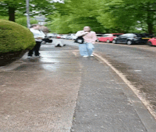 a blurry picture of people walking down a street