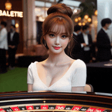 a woman sitting at a roulette table with a sign in the background that says balette