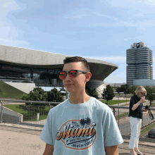 a boy wearing a miami beach vibe shirt