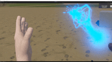 a computer screen shows a person 's hand reaching out towards a blue light