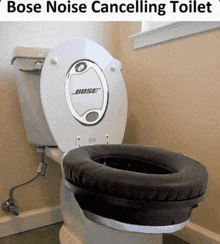 a toilet with bose noise cancelling headphones attached to it