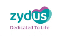 a logo for zydus dedicated to life with a heart in the middle