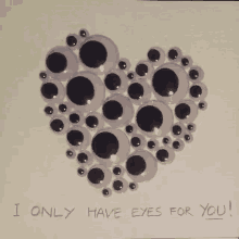 a heart made of googly eyes with the words " i only have eyes for you " below it