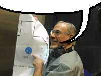 a man is pointing at a target that says " yes "