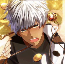 a man with white hair is holding a gold pendant