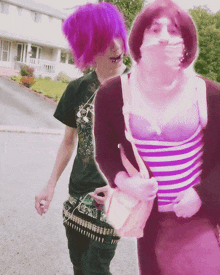 a person with purple hair is standing next to a person with a striped shirt