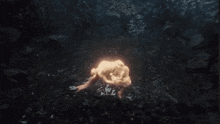 a woman is floating in the dark water