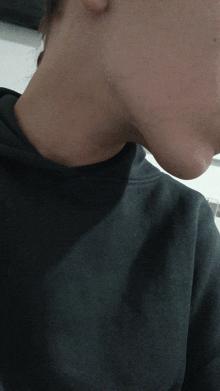 a close up of a person 's neck and chest