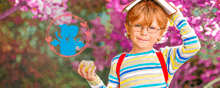 a young boy with glasses and a book on his head