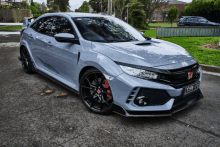 a gray honda civic with a license plate that says td20 jl