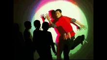 a group of children are standing in front of a projection of a man 's shadow .