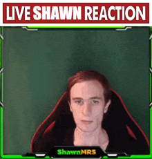 a man is sitting in front of a live shawn reaction banner