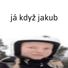 a blurry picture of a person wearing a helmet with the words ja kdyz jakub written on the bottom