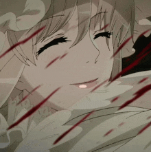 a close up of a girl 's face with blood coming out of her mouth