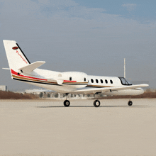 a turbojet is parked on a runway with its landing gear down