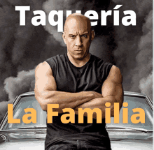 a man with his arms crossed is standing in front of a car that says la familia