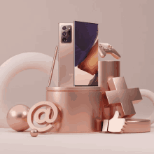 a samsung phone sits on a podium surrounded by various objects