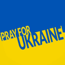 a blue and yellow flag with the words pray for ukraine