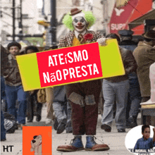 a clown is holding a sign that says ateismo nao presta