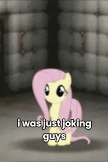 a cartoon pony is sitting in a room with the words `` i was just joking guys '' .