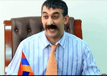 a man with a fake mustache is wearing a striped shirt and tie