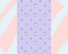 a purple background with a pattern of bunny faces and stars