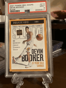 a basketball card with the name devin booker on the front