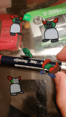 a person is holding a rotring tikky pen with cartoon characters on it