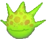 a green cartoon character with a crown on its head and a smile on its face .