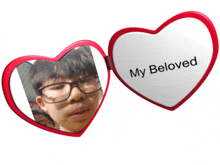 a heart shaped mirror with a picture of a boy and the words " my beloved "