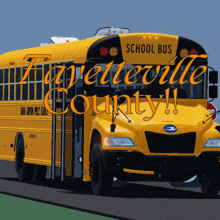 a yellow school bus is driving down the road with the words fayetteville county written on it