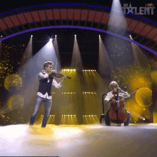 a man playing a violin and a woman playing a cello on a stage with a sign that says got talent