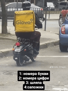 a man riding a scooter with a yellow bag that says glovo