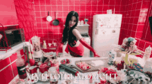 a woman in red gloves is standing in a messy kitchen with the words " myhtopia moment " written on the bottom