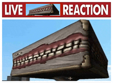 a live reaction sign with a picture of a monster