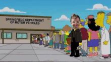 the springfield department of motor vehicles has a line of people waiting in front of it