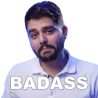 a man with a beard wearing a white shirt with the word badass on it